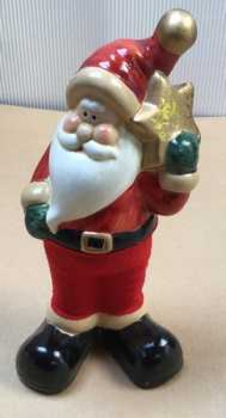Weihnachtsmann stehend mit Stern